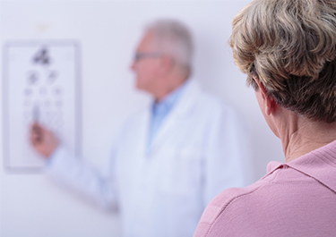 Doctor giving patient a vision test.