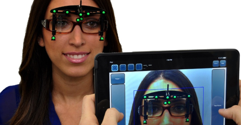 Lady with optikam on glasses and an ipad viewing them