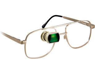 Gold glasses with a green visual field expsnder on the left lens